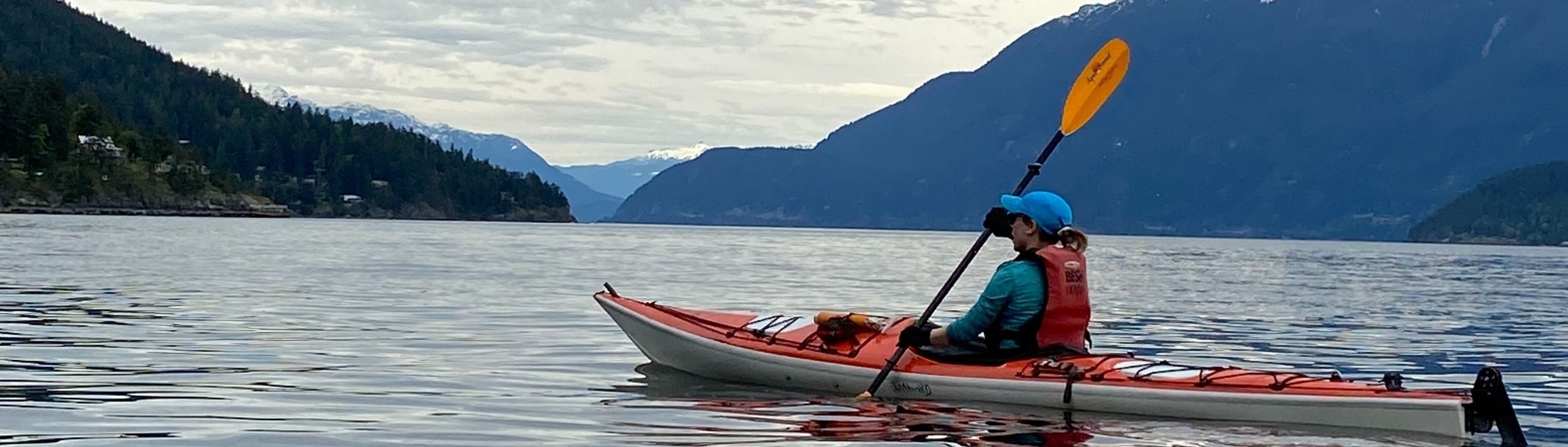 Woman kayaking near Snug Cove